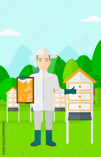 Bee-keeper at apiary.