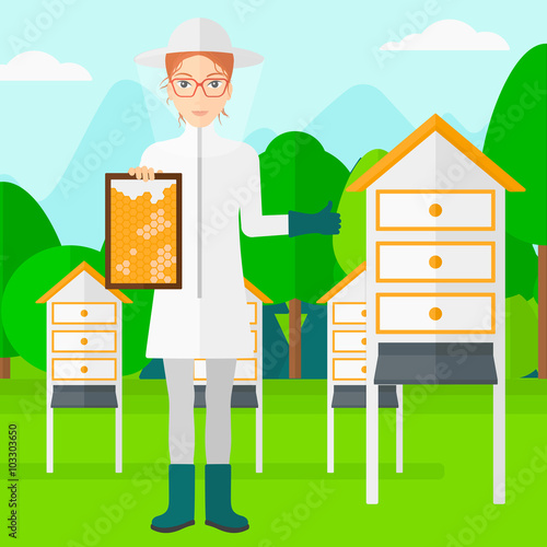 Bee-keeper at apiary.