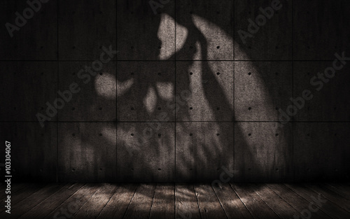 grunge background with shadow in the shape of a skull, scary dark underground room