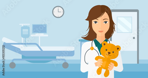 Pediatrician holding teddy bear.