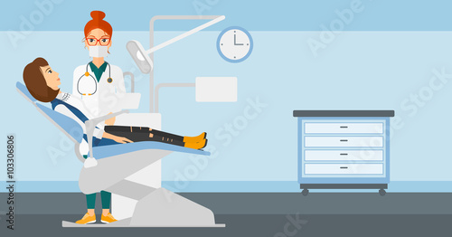 Dentist and woman in dentist chair.
