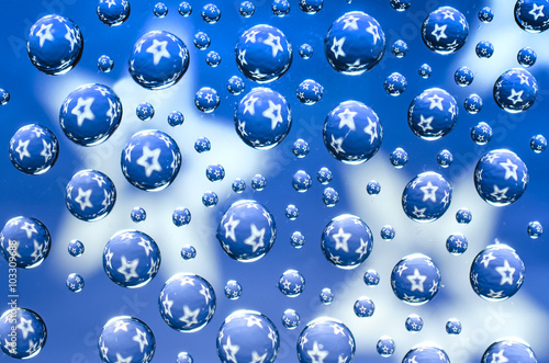 Water droplets with stars on a blue background