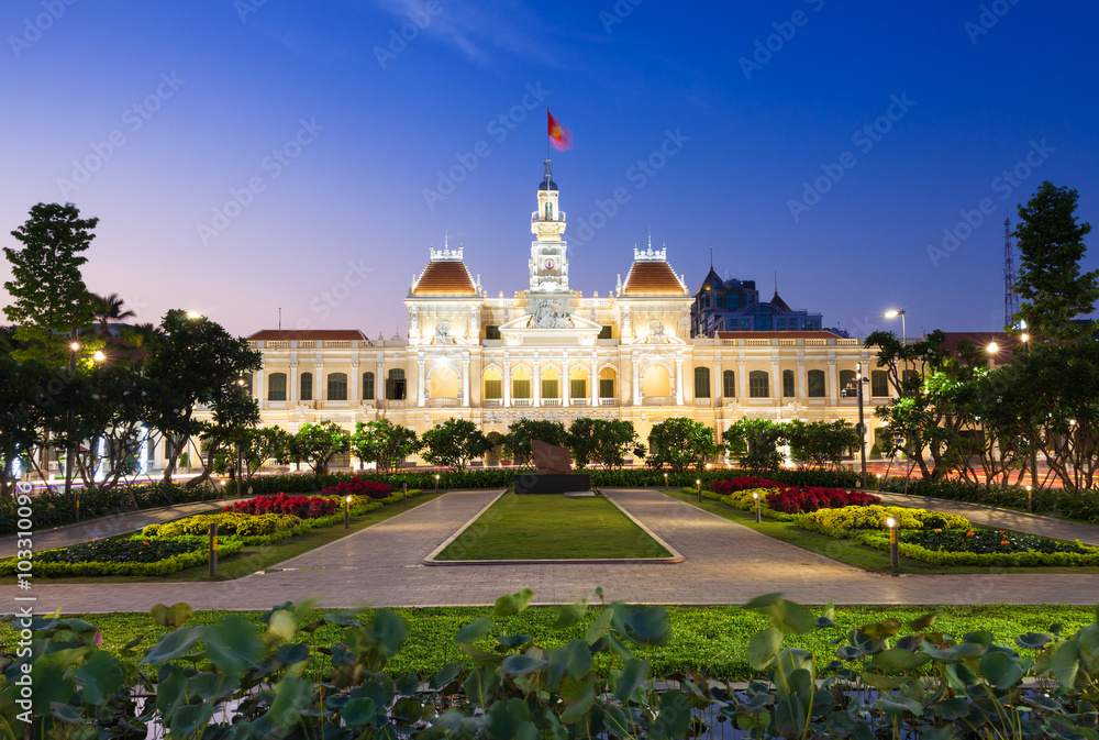People are walking and taking pictures in front of the City Hall building, Ho Chi Minh City, Vietnam on February 14, 2016.