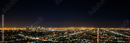 Panorama long exposure night view of Los Angeles downtown and surrounding metropolitan area from Hollywood hills