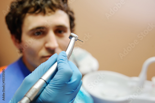 young guy in the dental office. fear of dentists