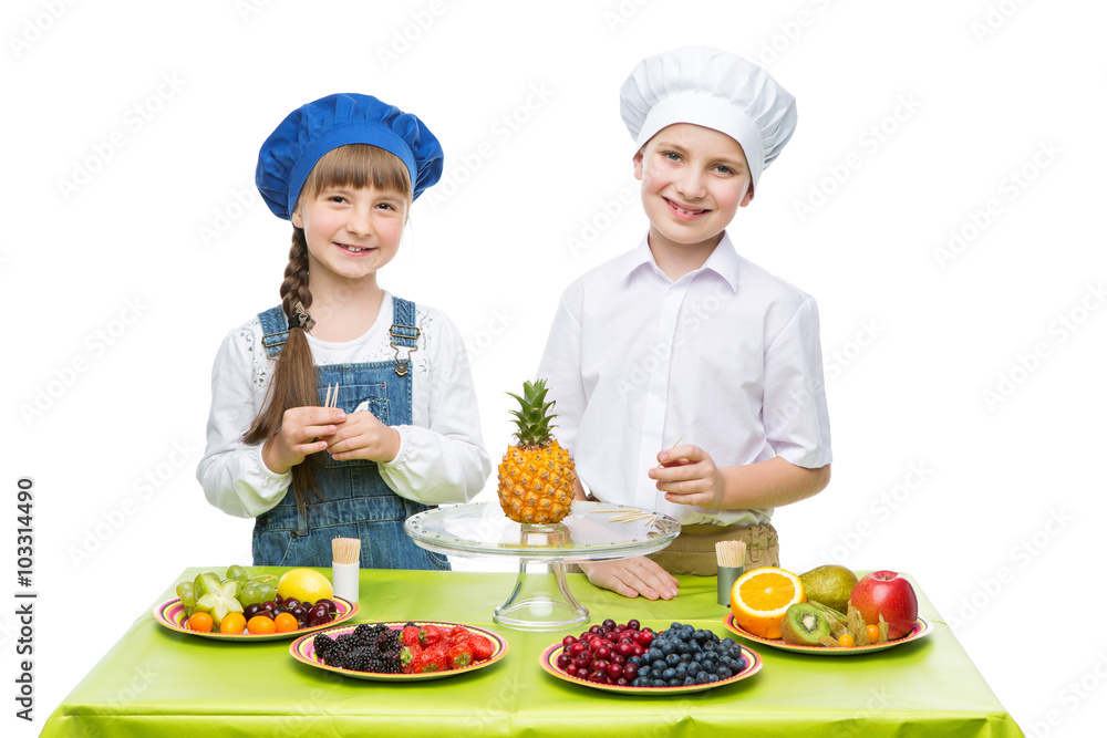 Children making fruit snacks