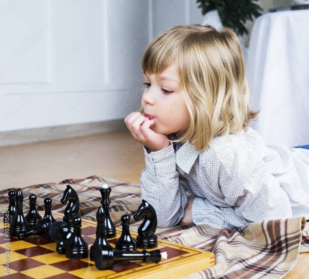 child playing chess child playing chess