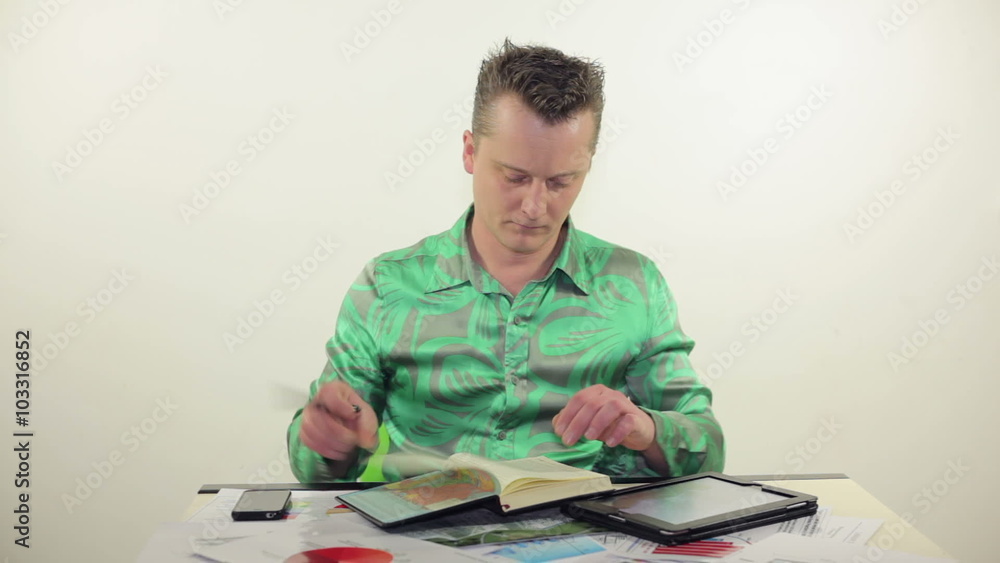 businessman working with tablet and documents businessman working with tablet and documents
