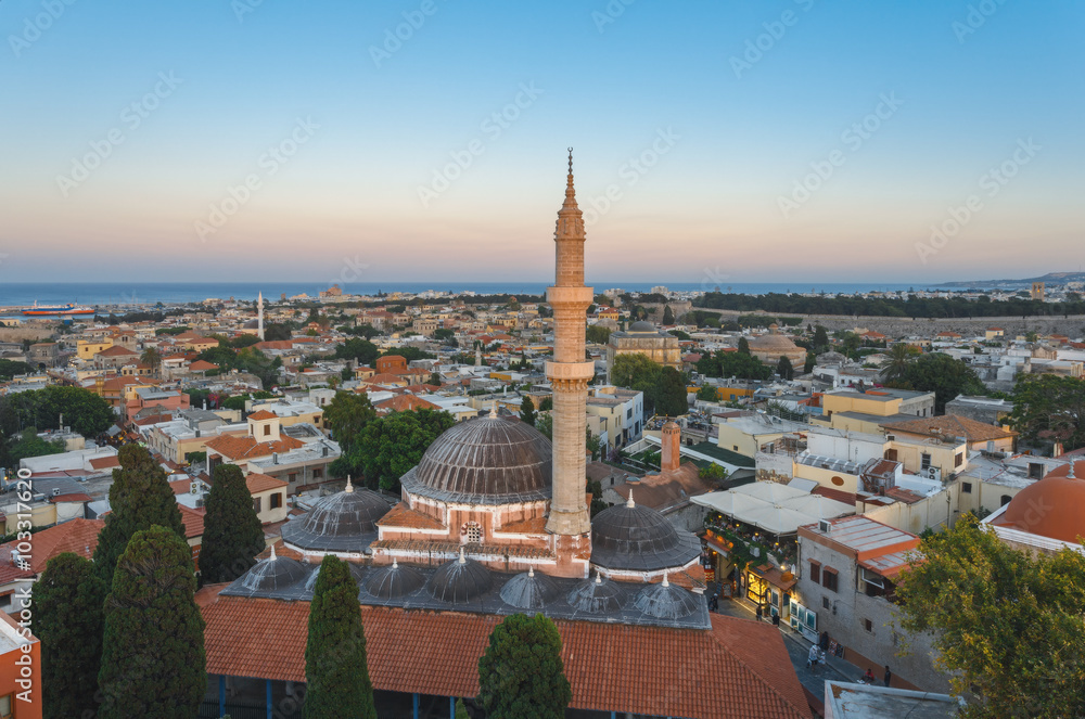 Greece, Rhodes. View of the old city and the Suleymaniye Mosque in the evening.