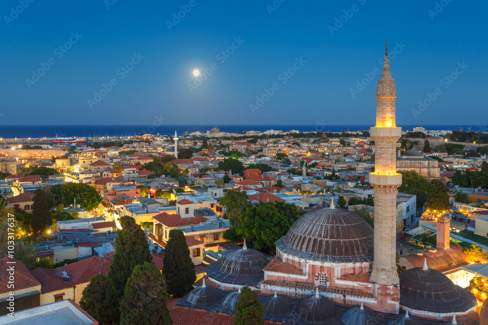  Greece, Rhodes. Panorama of the Old Town and the Mosque of Suleyman evening with the moon.