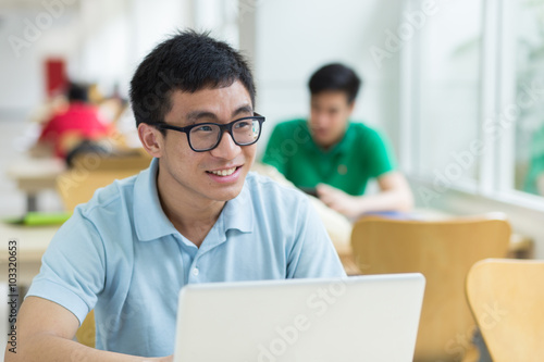 A student using laptop in the library