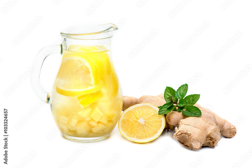 Ginger tea with lemon, ginger root and mint on white background