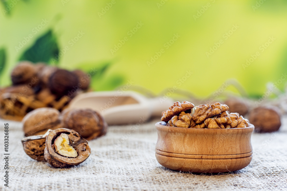 peeled walnuts lie in a wooden bowl peeled walnuts lie in a wooden bowl