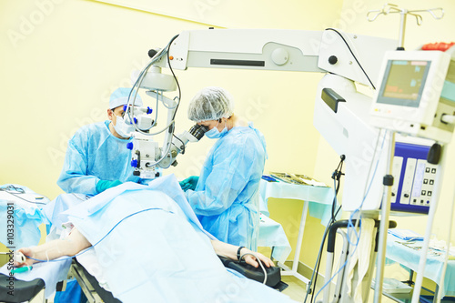 surgeon doctors in operation room