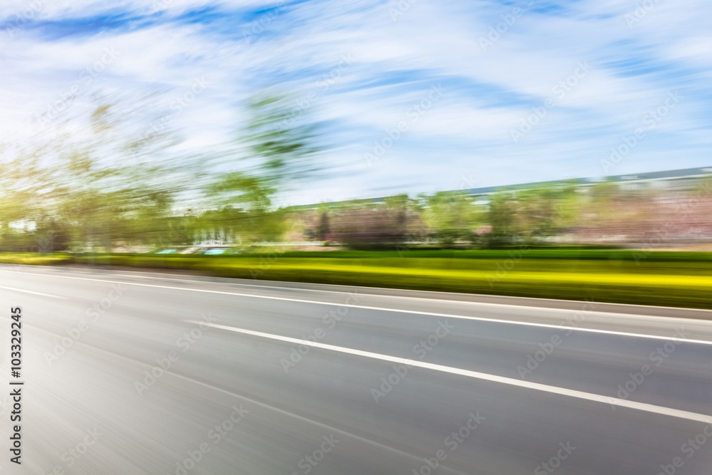 Car driving on road, motion blur Car driving on road, motion blur