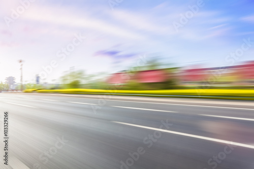 Car driving on road, motion blur
