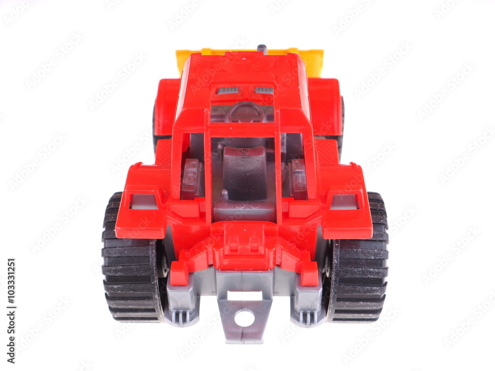 red toy tractor on a white background red toy tractor on a white background