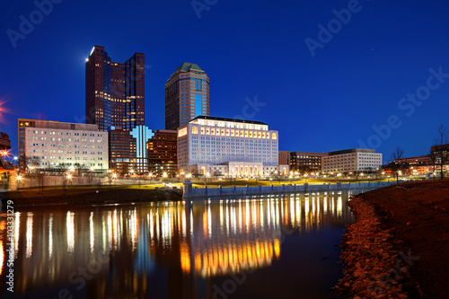 Scioto River and Columbus Ohio skyline at John W. Galbreath Bicentennial Park at dusk photo