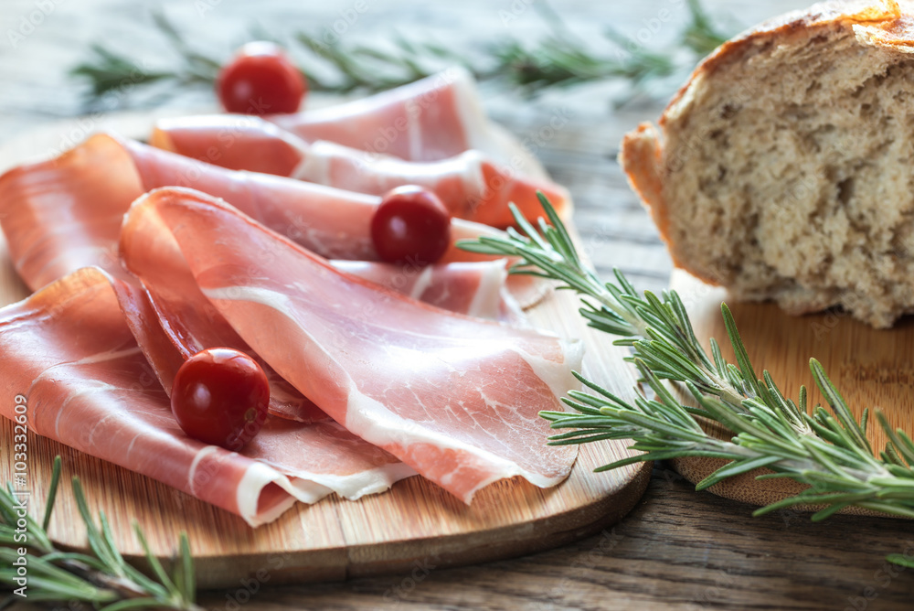 Slices of jamon on the wooden board