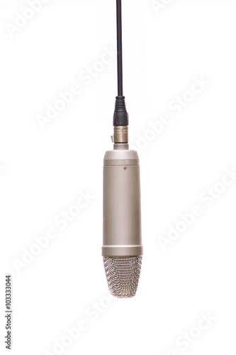 A Condenser Mic Hanging In Studio Isolated On White