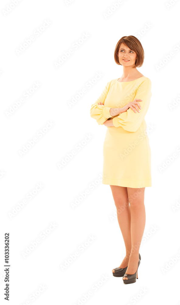 Adult woman in yellow dress looking up Adult woman in yellow dress looking up