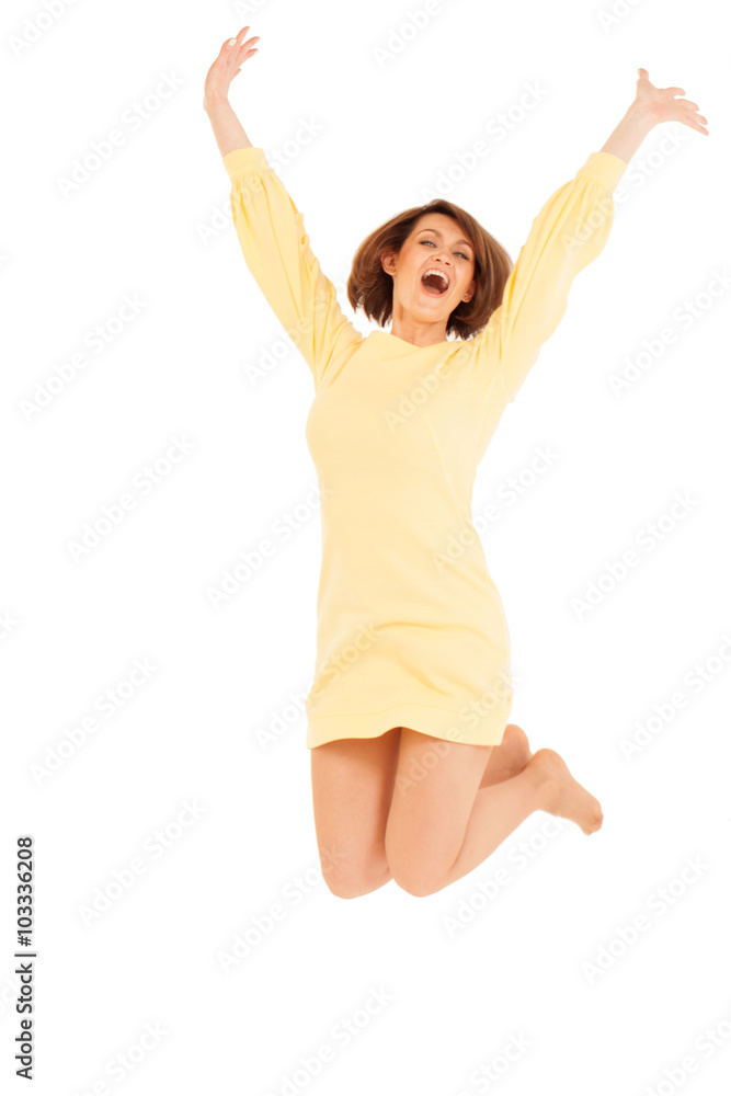 Smiling adult woman jumping with hands up Smiling adult woman jumping with hands up