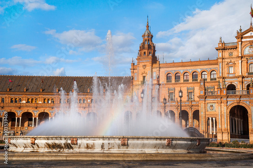 Fountain with rainbow on Plaza de Espana in Sevillle