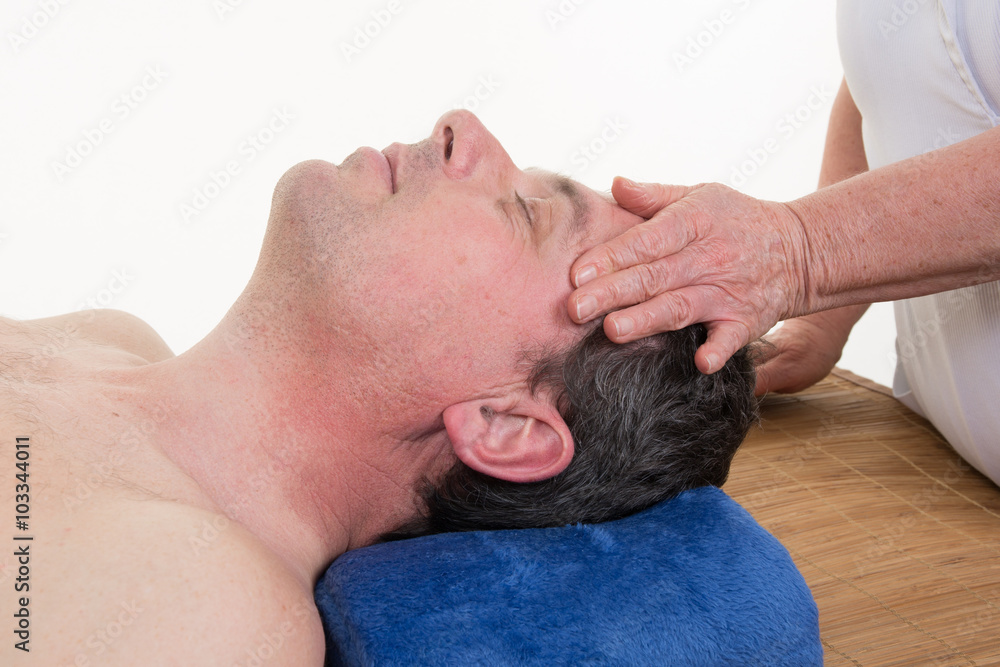 Man getting a face massage on beauty center