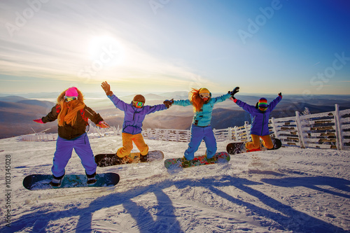Group of young people with snowboard