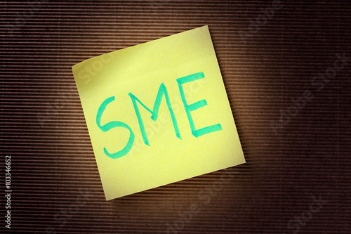 SME (Small Medium Enterprises) acronym on yellow sticky note