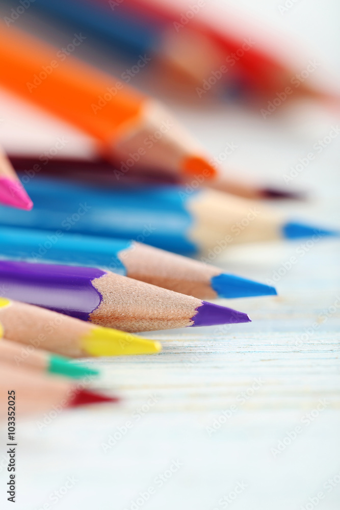 Drawing colourful pencils on a wooden background Drawing colourful pencils on a wooden background