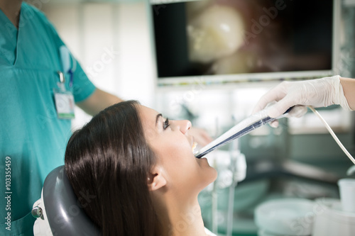Dental office-specialist tools intro oral dental camera with live picture of teeth on the monitor.Dental care dental hygiene check up.Dentist examines teeth of the patient.Plaque and caries prevention