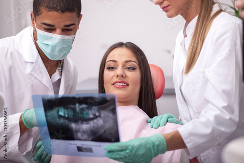 Fotografie Dentist explaining the details of x-ray picture to his patient