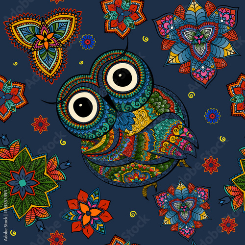 Seamless pattern from ornamental color owl with flowers and mandala. African, indian, totem, tattoo design. It may be used for design of a t-shirt, bag, postcard, a poster and so on.