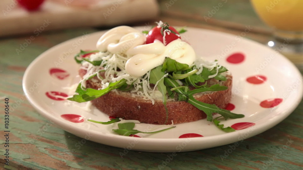 putting mayonnaise on sandwich. morning breakfast scene. putting mayonnaise on sandwich. morning breakfast scene.
