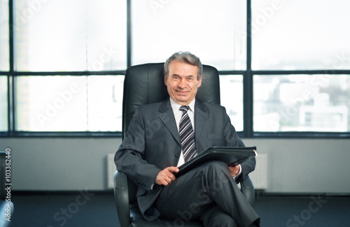 Confident businessman in office.