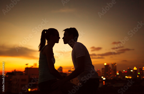Young couple kissing int he city. 