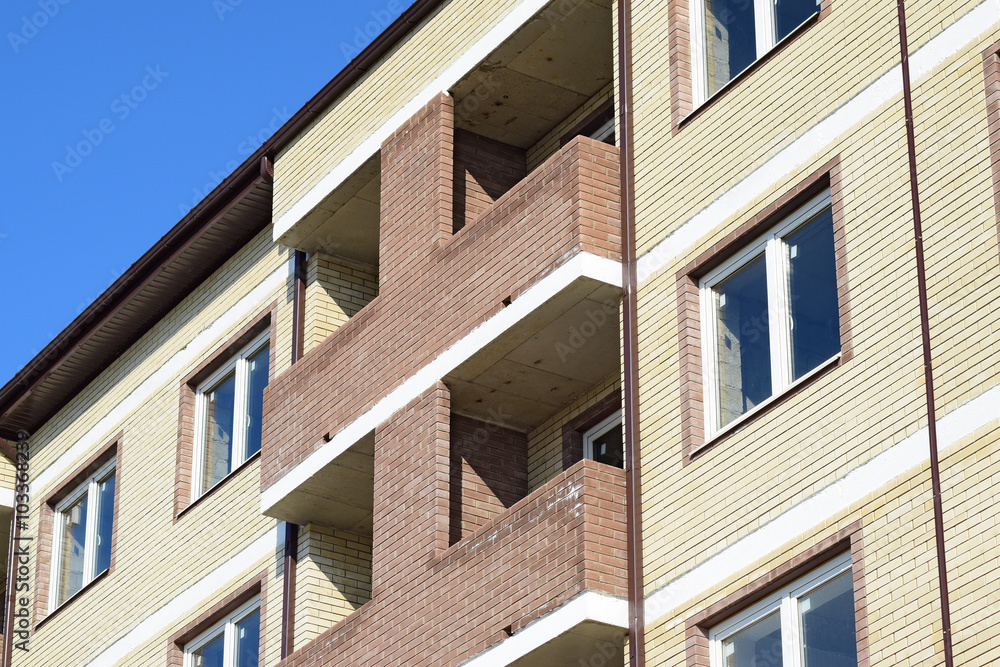 Balconies and windows of a multi-storey new house Balconies and windows of a multi-storey new house