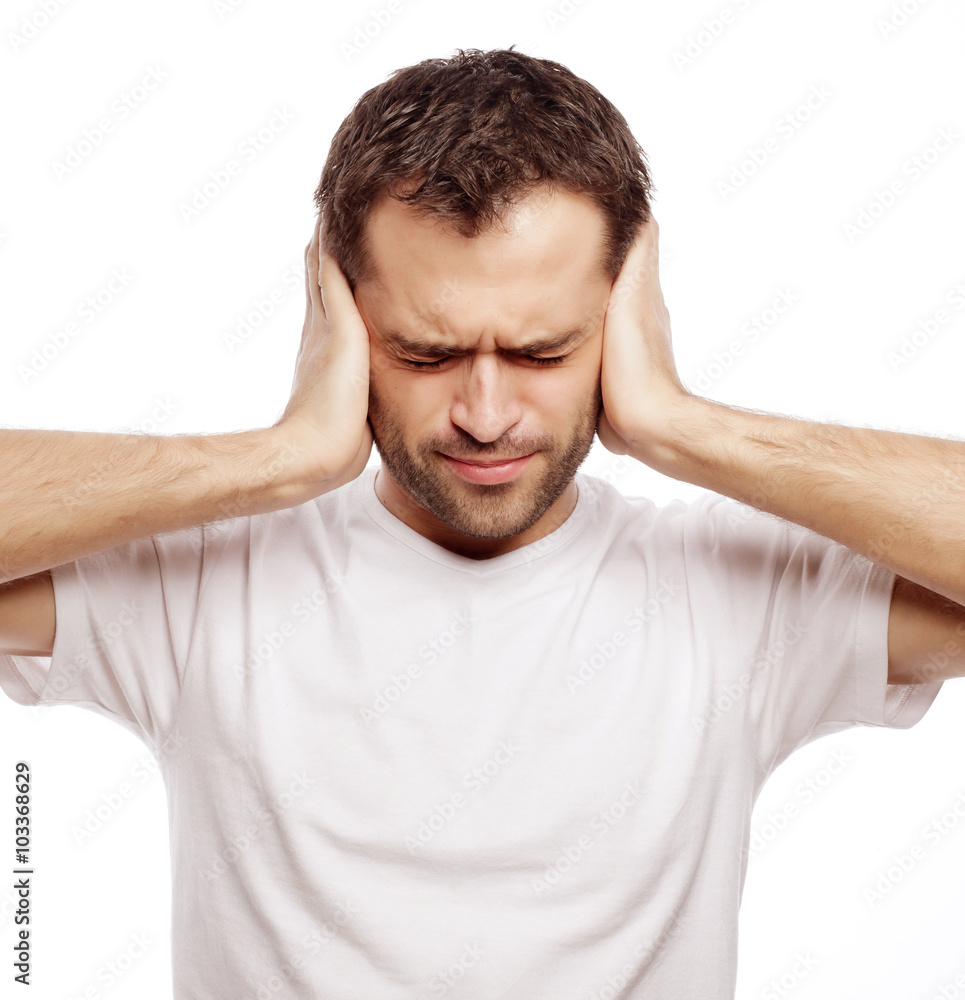 man hold hands on temples ears