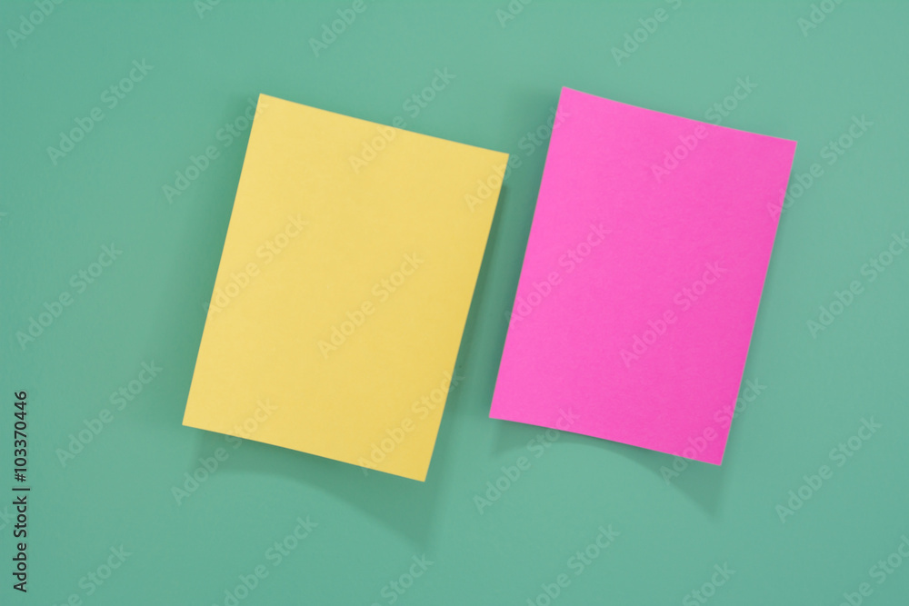 Colorful notes paper on green background Colorful notes paper on green background