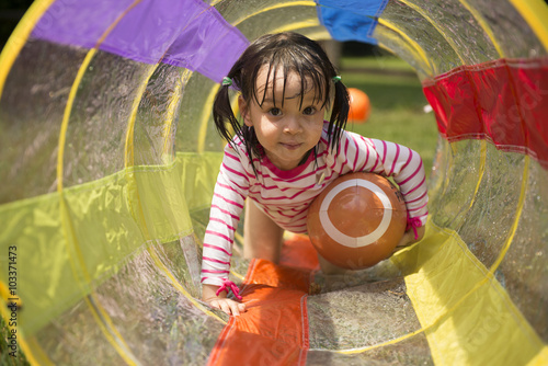 Little girl playing in backyard. photo