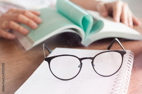 Woman reading book in coffee shop