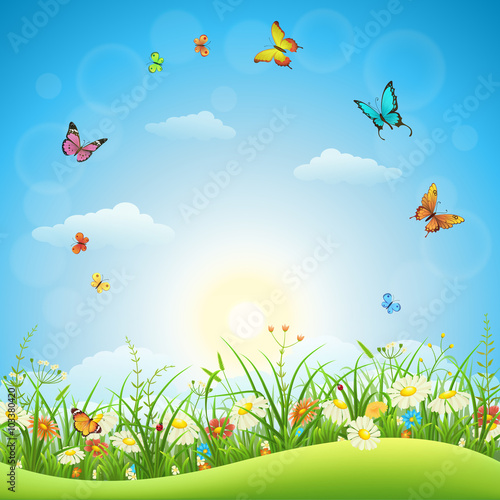 Naklejka Wiosna lub lato krajobraz z zieloną trawą, kwiatami i motylami