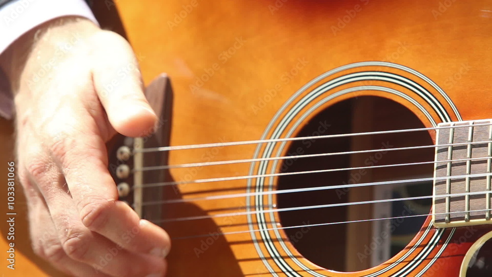 man plays guitar by beat of strings man plays guitar by beat of strings