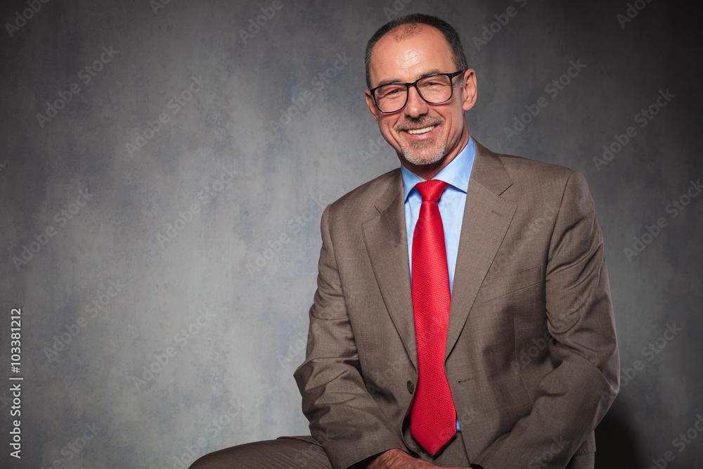 bald businessman wearing glasses while posing bald businessman wearing glasses while posing