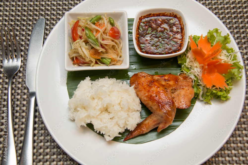 Green papaya salad, grilled chicken and sticky rice Green papaya salad, grilled chicken and sticky rice