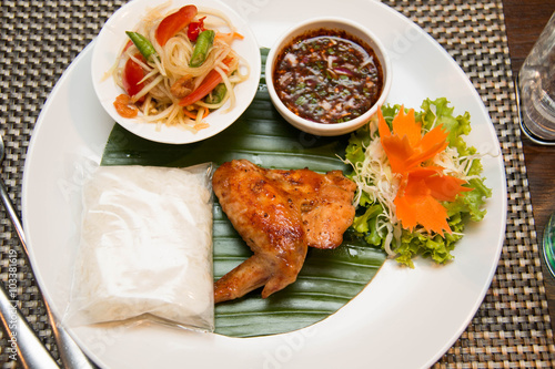  Green papaya salad, grilled chicken and sticky rice