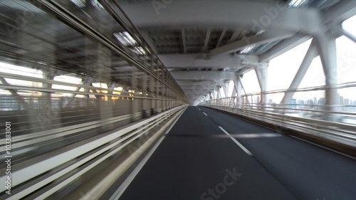 Rear view variation from a running car over the Tokyo Rainbow Bridge.