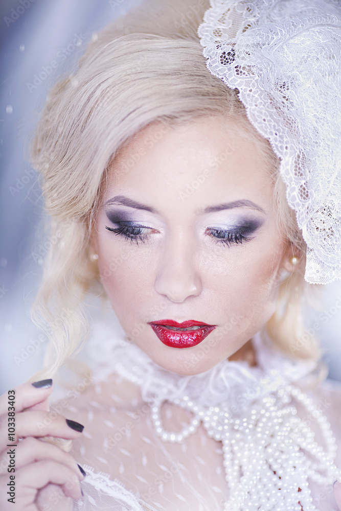 Winter Woman Portrait. Snow. Beauty Fashion Model Girl with White Hair and Blue Eyes closeup. Make up.
