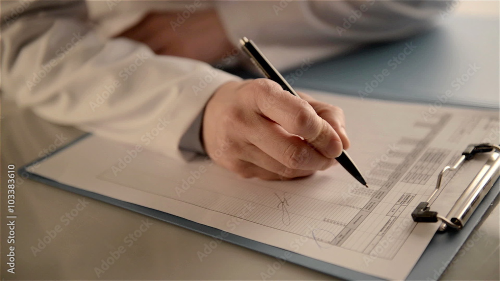 Close-up of woman physician hands holding ballpoint, studying patient's treatment scheme. Female doctor doing paperwork in the office. Close-up of woman physician hands holding ballpoint, studying patient's treatment scheme. Female doctor doing paperwork in the office.